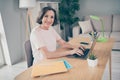 Photo portrait smiling senior woman working on laptop at home browsing internet typing message Royalty Free Stock Photo