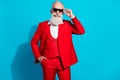 Photo portrait stylish elder businessman wearing sunglass red suit isolated bright blue color background Royalty Free Stock Photo