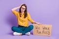 Photo portrait of upset troubled girl keeping carton placard looking for job need money isolated on bright purple color