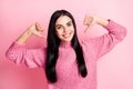 Photo portrait of woman pointing two thumbs at self isolated on pastel pink colored background Royalty Free Stock Photo