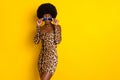 Photo portrait woman wearing leopard dress sunglass looking copyspace curious isolated vibrant yellow color background