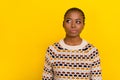 Photo portrait of young adorable girl not believe overthink empty space dressed stylish pullover isolated on yellow