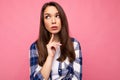 Photo portrait of young beautiful thinking and dreaming brunette woman in trendy blue and white shirt. Female person