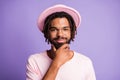 Photo portrait of young genius touching chin face beard with hand isolated on vivid purple colored background