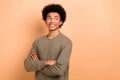 Photo portrait of young optimist guy satisfied business worker wear brown sweatshirt folded hands look empty space