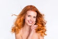 Photo portrait of young woman wavy red hair happy smiling touching face tender ideal smooth skin isolated white color Royalty Free Stock Photo