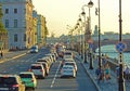 Rush hour on a broad four-lane street running along the river in Saint Petersburg, Russia