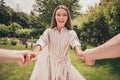 Photo portriat young woman holding boyfriend hands laughing overjoyed spending time in park