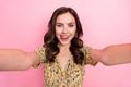 Photo of positive adorable girl make selfie tongue lick teeth have good mood  on pink color background Royalty Free Stock Photo