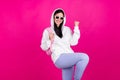 Photo of positive astonished lady rejoice victory triumph wear backpack white sweatshirt isolated pink color background