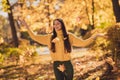 Photo of positive cheerful girl have fall weekend holiday relax outdoors woods park catch throw fall fly maple yellow