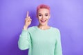 Photo of positive excited girl wear turquoise sweater pointing finger up having great idea isolated violet color Royalty Free Stock Photo