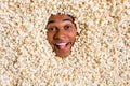 Photo of positive funny guy have spend free time weekend watch tv television film show tongue out isolated pop corn