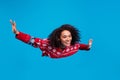 Photo of positive girl flying air on magic miracle christmas night isolated over blue color background Royalty Free Stock Photo