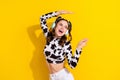 Photo of positive girl meloman wear headset spot print clothes look empty space dance isolated shine color background