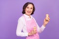 Photo of positive happy retired old woman hold salt pepper cook meal dinner isolated on purple color background