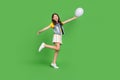 Photo of positive kid girl hold flying balloon green color background