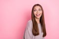 Photo of positive pretty satisfied lady beaming bright smile trendy sweater interested look empty space isolated on pink