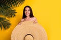 Photo of positive shocked lady wear bikini close body big sun hat empty space isolated yellow color background