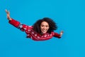 Photo of positive smiling cheerful lady flying dream christmas spirit miracle isolated over blue color background Royalty Free Stock Photo