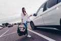 Photo of positive sweet mom small daughter wear casual outfits open putting car seat inside automobile vehicle Royalty Free Stock Photo