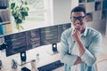 Photo of positive young funny man startup programmer nft collection designer coder test his new service thinking indoors