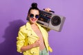 Photo of positive youngster lady hold shoulder boom box over violet color background