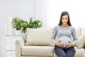 Photo of pregnant woman hugging her stomach Royalty Free Stock Photo