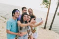 Photo of pretty attractive best buddies walking embracing recording self video enjoying summer time outdoors ocean