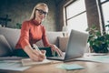 Photo of pretty business lady texting notebook colleagues working home noticing startup details in organizer wear specs