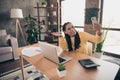 Photo of pretty charming young woman dressed yellow sweater having video call modern gadget smiling indoors home room Royalty Free Stock Photo