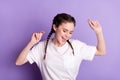 Photo of pretty cheerful girl open mouth smile raise hands partying isolated on violet color background Royalty Free Stock Photo