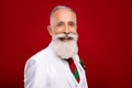Photo of pretty confident age gentleman wear new year costume smiling empty space isolated red color background