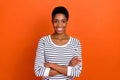 Photo of pretty confident butch worker dressed sweater arms folded smiling isolated orange color background