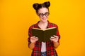 Photo of pretty crazy lady two buns hold open book diligent student interesting story novel wear geek vision specs Royalty Free Stock Photo