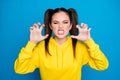Photo of pretty crazy lady two tails hairdo raise arms showing claws grinning evil irritated annoyed person wear casual
