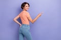 Photo of pretty cute lady wear striped outfit clothes arm pocket direct index empty space isolated on purple color Royalty Free Stock Photo