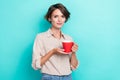 Photo of pretty cute lady wear stylish clothes hold mug hot tasty tea enjoy free time moment empty space on