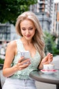 Photo of pretty cute lovely girl sitting cafe table summer terrace chatting wrtiting comments reading posts weekend day Royalty Free Stock Photo