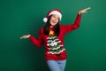 Photo of pretty cute relaxed japanese woman raise hands up active motion dancing xmas music wear ugly sweater isolated