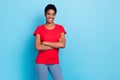 Photo of pretty cute short hair human wear red t-shirt arms crossed empty space isolated blue color background