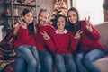 Photo of pretty funky mom dad sister brother smiling celebrating noel showing v-signs indoors house home room