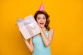 Photo of pretty funny lady hold big giftbox hands unexpected present try to guess what inside wear pink paper birthday