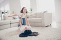 Photo of pretty funny little girl young mommy holding daughter hands above floor having fun pretending airplane flight Royalty Free Stock Photo
