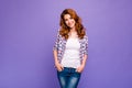 Photo of pretty ginger lady with amazing wavy hairstyle wear checkered casual shirt and blue jeans isolated purple color