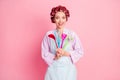 Photo of pretty happy brown haired housewife hold utensils dinner chef wear dotted apron isolated on pink color Royalty Free Stock Photo