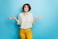 Photo of pretty lady raise hands shrug shoulders do not care friends problems ignoring smile wear casual green shirt Royalty Free Stock Photo