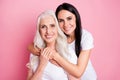 Photo of pretty old mother young daughter two ladies good mood hugging piggyback generation love comfort wear casual Royalty Free Stock Photo