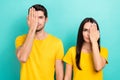 Photo of pretty serious husband wife dressed yellow t-shirts arms close eyes isolated turquoise color background