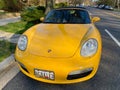 Pretty Yellow Porsche Sports Car Parked on the Street Royalty Free Stock Photo